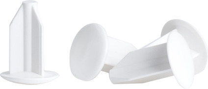Vita plastproppar med rundad topp och platt bas, avsedda för täckning av skruvhål. Fyra stycken.