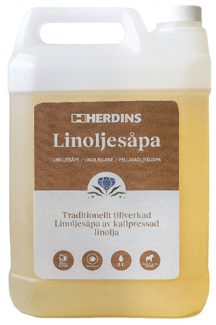 Kanna med Herdins Linoljesåpa naturell, etikett med text och ikoner, genomskinlig vätska.