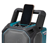 Blå och svart Makita XGT radio med en smartphone placerad i en hållare ovanpå.