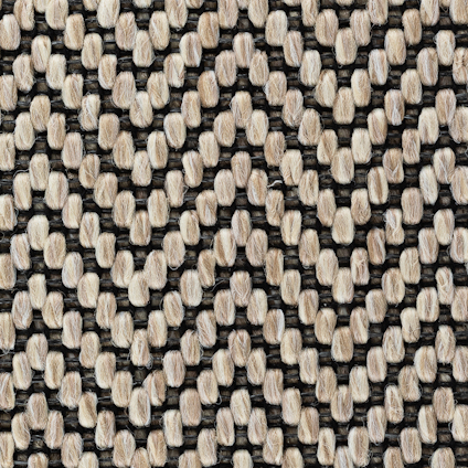 Beige och svart zigzagmönstrat textilgolv i fiskbensmönster.