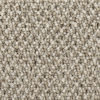Närbild av beige och brunmelerat textilgolv med öglad struktur.
