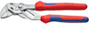 Tångnyckel med rödblåa handtag och metalliska käftar. Märkt med "KNIPEX" och kapacitetsinformation på handtagen.