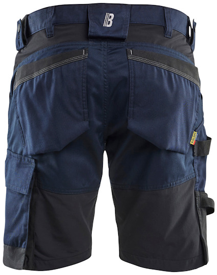Mörkblå och svarta arbetsshorts med flera fickor och förstärkta partier.