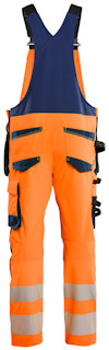 Orange och blå arbetshängselbyxor med flera fickor och reflexdetaljer.