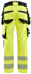 Gula varselbyxor med reflexband och flera fickor, sedda bakifrån.