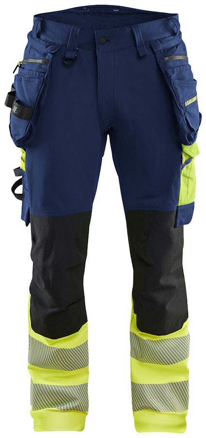 Marinblå arbetsbyxor med gula detaljer och reflexband vid knäna.