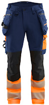 Marinblå arbetsbyxor med orange detaljer, reflexband och svarta knän. Flera fickor och hällor.