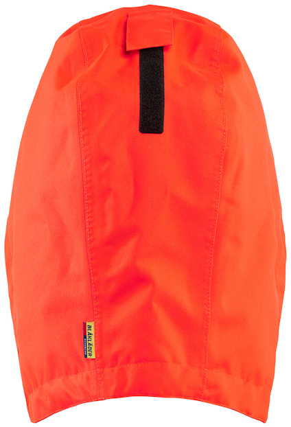 Orange klädesplagg med svart kardborreband och en etikett med texten "Fristads".