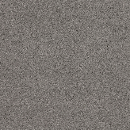 Grå och svart prickig yta på en laminatbänkskiva med stenmönster.