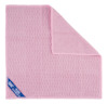 Rosa mikrofiberduk med textur, ett hörn vikt uppåt och etikett med text: "SENTA SEDA INS".