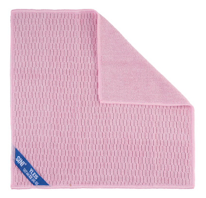 Rosa mikrofiberduk med textur, ett hörn vikt uppåt och etikett med text: "SENTA SEDA INS".
