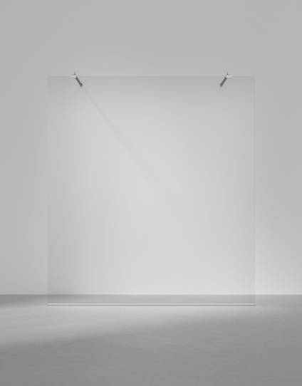 Transparent glass panel with metallic brackets on a plain gray background.