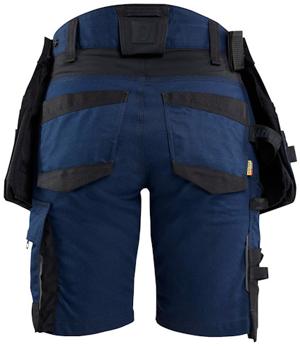 Blå och svarta arbetsshorts med flera fickor och bältesöglor, sedd bakifrån.