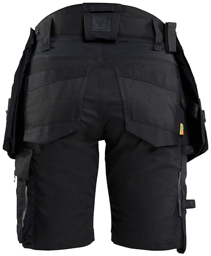 Svarta arbetsshorts med flera fickor och förstärkta partier, sedda bakifrån.