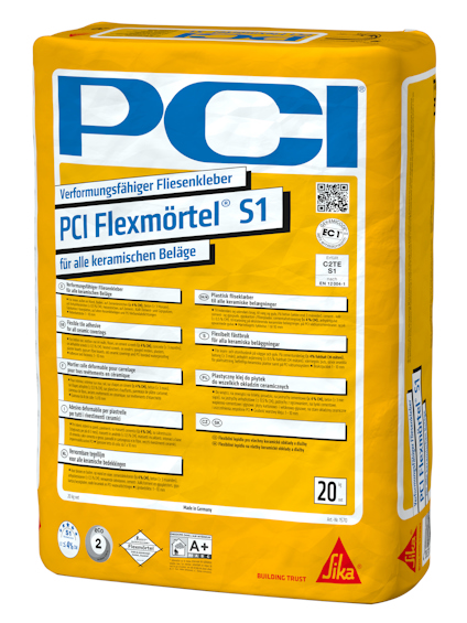 Förpackning av PCI Flexmörtel S1 i gul säck med instruktioner och logotyper.