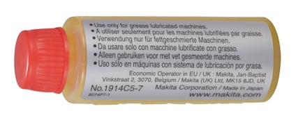 Gult rör med röd kork och etikett med instruktioner för användning av smörjmedel på flera språk.