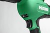 Grön och svart elektrisk borrmaskin, märkt "HiKOKI", med en justerbar hastighetskontroll justerad till 6.