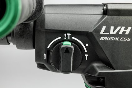 Närbild på justeringsknapp på en borrliknande elvertyg. Text: "LVH BRUSHLESS". Justerbara symboler visas bredvid knappen.