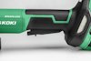 Närbild av grön och svart sladdlös borrmaskin med "BRUSHLESS" och text på sidan.