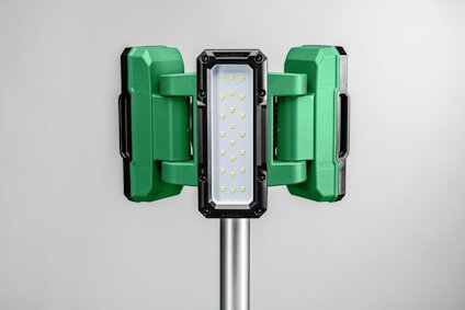 Grön och svart LED-arbetslampa på metallstativ, med flera lysdioder synliga.