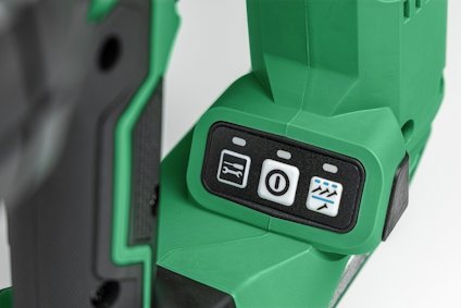 Grön elektrisk verktyg med kontrollpanel med tre knappar, inklusive en med en nolla och en med en man som springer.