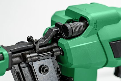 Grön och svart pneumatisk enhet med en justerbar vridknapp och metallkomponent.