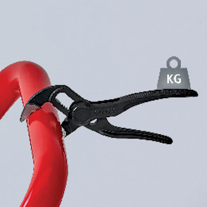 Svart tång håller ett rött föremål. Ord "Knipex" syns på tången. Diagramikon med "KG" visas till höger.
