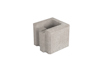Grå betongblock med en rektangulär form och öppning på toppen.