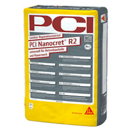 Förpackning av PCI Nanocret R2 med tysk text och gul etikett.